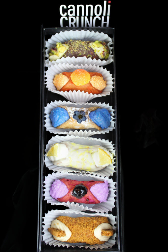 <p><span data-mce-fragment="1">Introducing our delectable SetBox of 6 Small Cannoli, crafted with passion and precision to delight your taste buds. Each cannolo is a miniature masterpiece, filled with rich, creamy goodness and enveloped in a delicate, crispy shell.&nbsp; </span>Included in the SetBox of 6 Small Cannoli are:</p> <p>Top to Bottom~Chocolate Pistachio, Peach Fuzz, Blue Matcha, Lemon Truffle, Cherries Jubilee, and The Biscoff.&nbsp;&nbsp;</p>