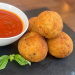 Experience the true taste of Italy with our Authentic House-Made Arancini. These golden, crispy rice balls are filled with a rich blend of melted mozzarella, peas and perfectly blended herbs, then fried to a crunchy finish. Each bite offers a delightful contrast of creamy inside and crisp exterior, making them an irresistible appetizer or snack. Made fresh daily, our arancini bring the timeless essence of Italian comfort food right to your table.