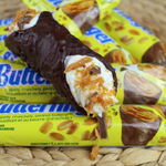 The Buttery Finger Cannoli pays homage to the beloved chocolate bar and adds our forever fabulous twist to the traditional cannoli.  At the heart of the Buttery Finger experience is its unmistakable peanut butter flavour blended with our smooth and creamy ricotta. Our crispy, crunchy pastry shell is enrobed in rich, velvety chocolate, and the ends are embellished with Butter Finger pieces.  Each bite is a delightful balance of sweet and salty. It's a flavour combination that's stood the test of time!