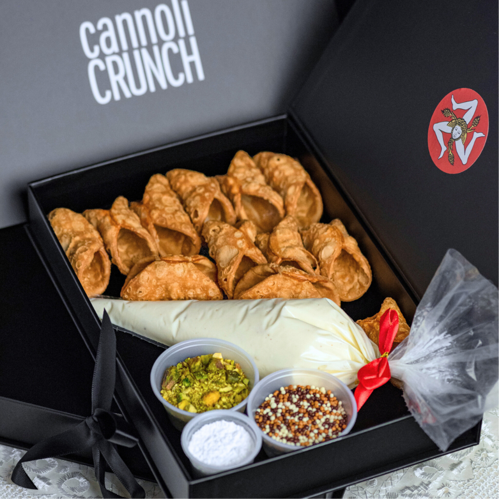 Are you commuting, do you want to have some fun or do you wish to enjoy a box of Cannoli for a couple of days?  In the pursuit of maintaining the crispy, crunchiness of our pastry shells, Cannoli Crunch has created a DIY Kit.  Included in the Kit are:  12 cannoli pastry shells, traditional ricotta cream, and pistachios, chocolate pearls, and icing sugar.