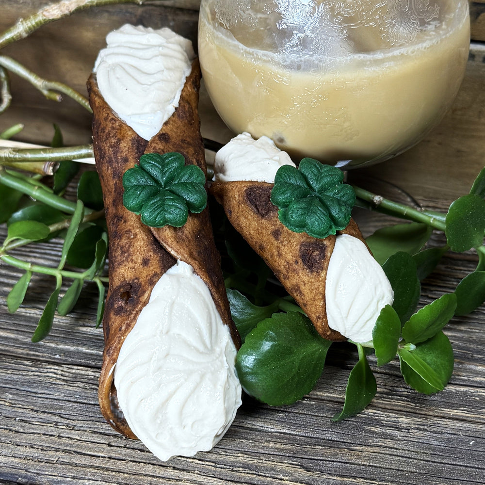 Our golden, crispy cannoli shell is adorned with a marzipan shamrock on top for good luck! Inside, we fill it with a luxuriously creamy ricotta filling, blended with Bailey’s Irish Cream for that unmistakable hint of whiskey, vanilla, and chocolatey warmth. 