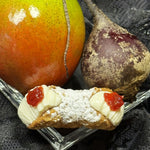 Chef Shivam is a culinary genius!&nbsp; His newest fusion is ripe, juicy mango with the earthy depth of beetroot, creating a vibrant jelly!&nbsp; Piped into the centre of our creamy, smooth ricotta, and nestled inside our crispy, crunchy cannoli shell, the bright, tangy jelly adds a burst of colour and flavour!&nbsp; It’s the perfect balance of sweet and savoury! Whether you’re a daring foodie or just looking to try something new, the Mango Beet Jelly Cannoli is an adventure in every bite .