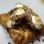 Here's a true taste of Ontario's maple syrup season! As the maple sap runs in the lush forests of Ontario, we’ve captured that pure, golden goodness in every bite of this irresistible treat. The crisp, delicate cannoli shell rolled in pecans is filled with a luscious, maple-infused ricotta cream.&nbsp; It’s like a taste of spring with a nod to the tradition of maple tapping and the flavours that make this time of year so special. Treat yourself to a cannoli that’s as Canadian as it gets!