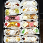 Included in the SetBox of 12 are:

Left Row:&nbsp; Signature Strawberry Jelly, Traditional Pistachio, The Hibiscus, The Upside Down Pineapple, Traditional Chocolate, Signature Lemon Jelly,

Right Row:&nbsp; Signature Lavender Jelly, Traditional Orange, The Honeyed Sesame, Pink Angelhair Chocolate, Traditional Cherry, and Signature Blueberry Jelly

Stop for a moment, enjoy the flowers, give thanks for the Mom in your life with the taste of freshly piped, fusion cannoli!