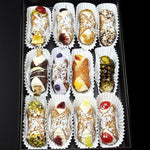 Luxuriate in the ultimate Italian treat with our SetBox of 12 Assorted Gourmet Cannoli. Top Row (left to right):&nbsp; The Everything, Blueberry Jelly, Rhubarb/Ginger Jelly, Traditional Chocolate

Middle Row (left to right):&nbsp; The Wafer, The Coconut Ube, The Peach Cobbler, The Sugar'd Pickle

Bottom Row (left to right):&nbsp; Traditional Pistachio, Raspberry Jelly, Lemon Jelly, and Traditional Cherry.