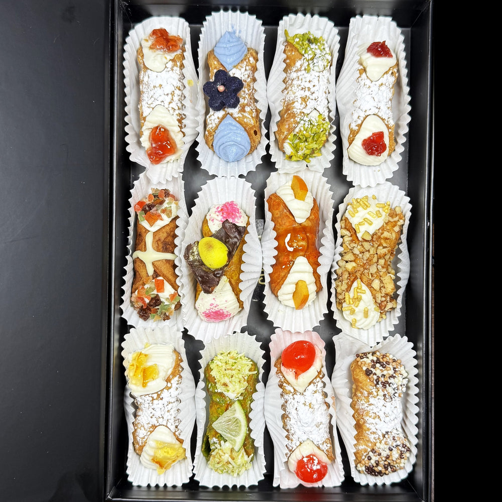 Included in the SetBox of 12 are:

Top Row:&nbsp; Signature Mango/Beetroot Jelly, The Blue Matcha, Traditional Pistachio, Signature Fieldberry Cannoli,

Middle Row:&nbsp; The Hot Cross Bun, The Easter Egg Basket, The Persimmon, The Maple Walnut,

Bottom Row:&nbsp; Signature Ginger/Rhubarb Jelly, The Coconut Lime, Traditional Cherry, and Traditional Chocolate.

Enjoy a breath of Spring Air and a taste of freshly piped, fusion cannoli!
