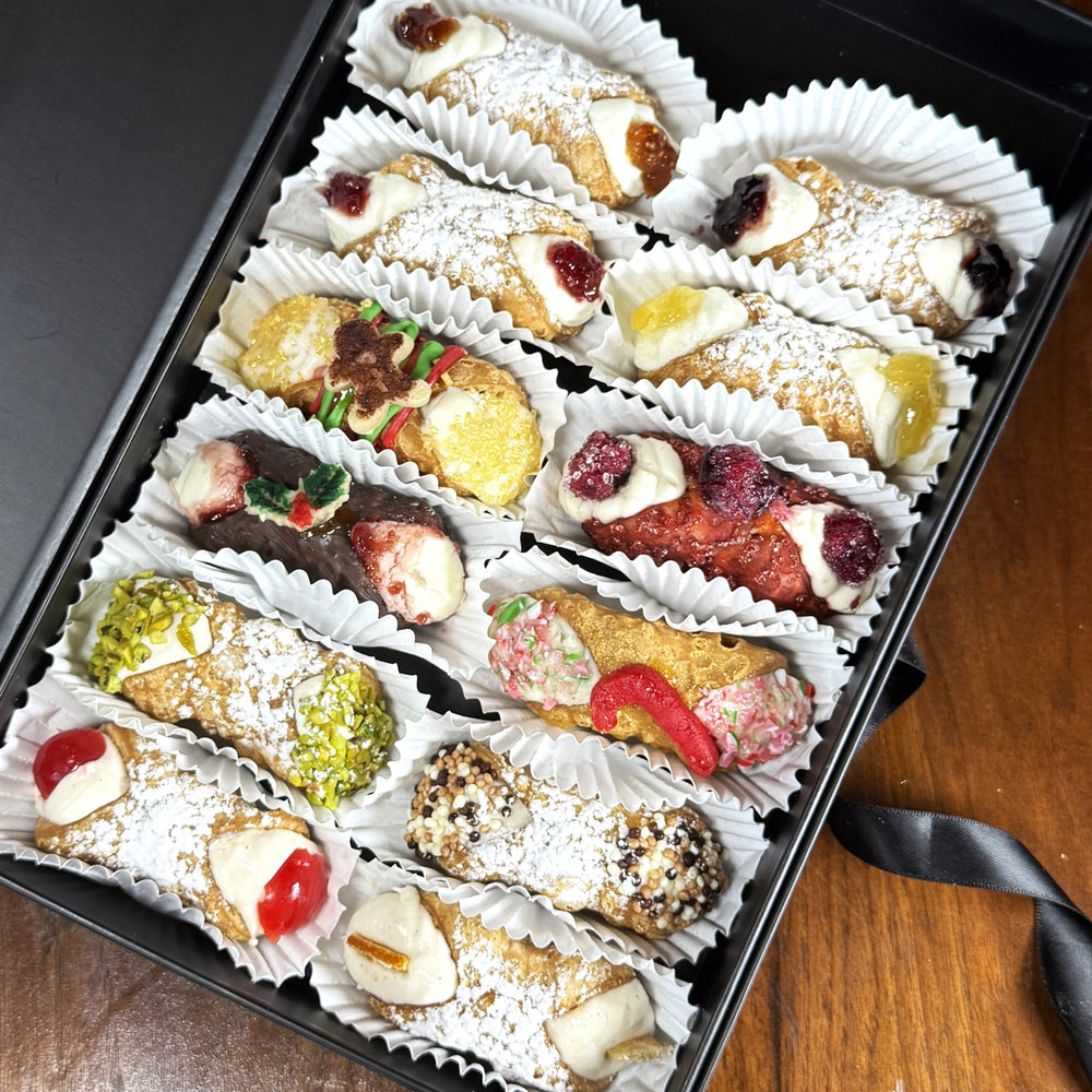 Included in this SetBox of 12 Cannoli are:

Left Row (top to bottom):&nbsp; Signature Strawberry Rhubarb Jelly, Signature Mixed Berry Jelly, The Gingerbread, The Chocolate Yule, Traditional Pistachio, and Traditional Cherry.

Right row (top to bottom):&nbsp; Signature Blackberry Jelly, Signature Pear Reisling Jelly, The Mulled Wine, The Candy Cane, Traditional Chocolate, and Traditional Orange.

Enjoy your time together!