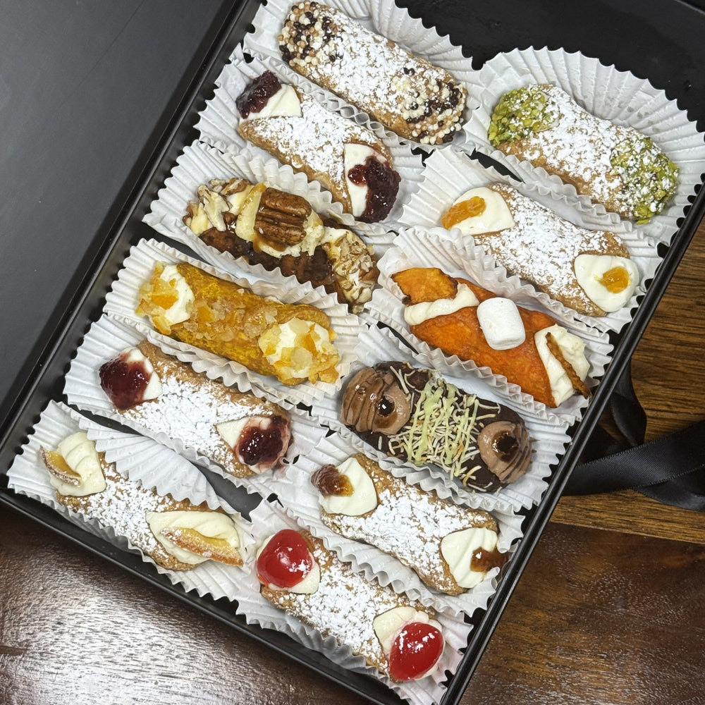  As the autumn notes fill the horizon, draw close to the sweet traditions with a bite of these delicious, handcrafted delicacies! Included in the SetBox are:

Left row (top to bottom):&nbsp; Traditional Chocolate, Signature Blueberry Jelly, Dubai Chocolate Lava Cake, Yuzu, Signature Cherry Jelly, Traditional Orange,

Right row (top to bottom): Traditional Pistachio, Signature Pineapple Jelly, Marshmallow Sweet Potato, Signature Fig Jelly, and Traditional Cherry. 