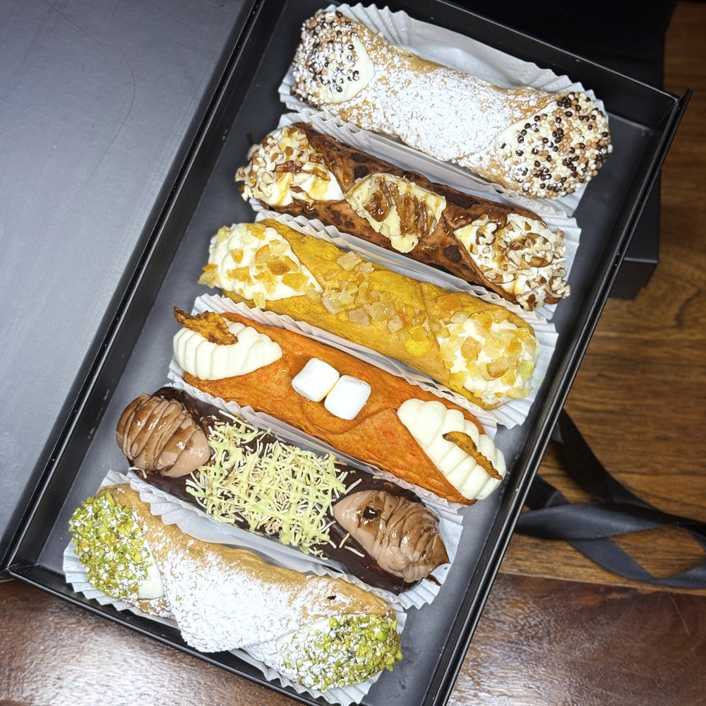 Included in the SetBox of 6 Large Gourmet Cannoli are:

Top to bottom:&nbsp; Traditional Chocolate, The Maple Pecan Fudge, The Yuzu, The Marshmallow Sweet Potato, The Dubai Chocolate Lava Cannoli, and Traditional Pistachio.

Buon apettito!