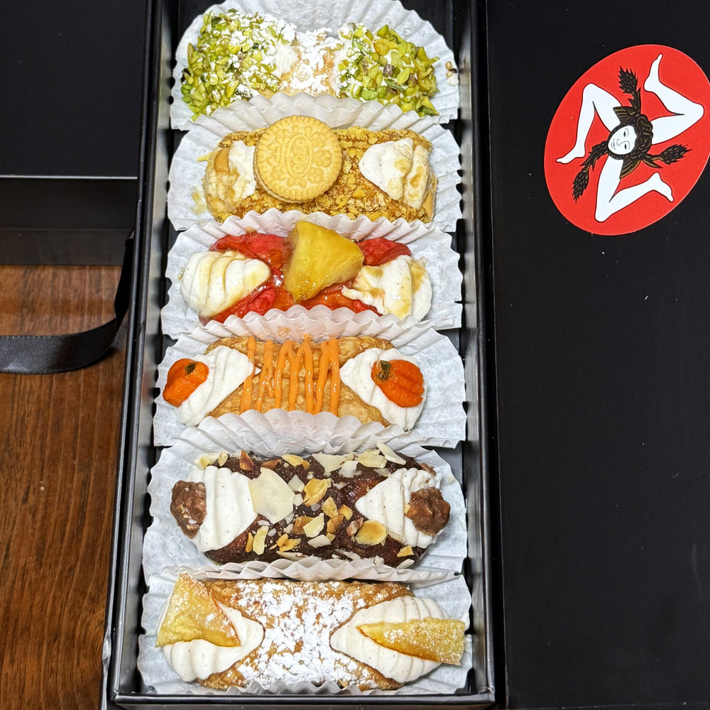 Our SetBox of 6 Large Cannoli is the ultimate Italian dessert experience! Each box contains six meticulously crafted, crispy cannoli shells filled with a rich, creamy blend of sweet ricotta cream, delicately flavoured with trending emulsions and reductions.&nbsp; Included in the SetBox of 6 Small Gourmet Cannoli are:

Top to bottom:&nbsp; Traditional Pistachio, The Golden Oreo, The Candy Apple, The Pumpkin Spice, The Chocolate Almond Cluster, and Traditional Orange.

So much to be grateful for this Season!
