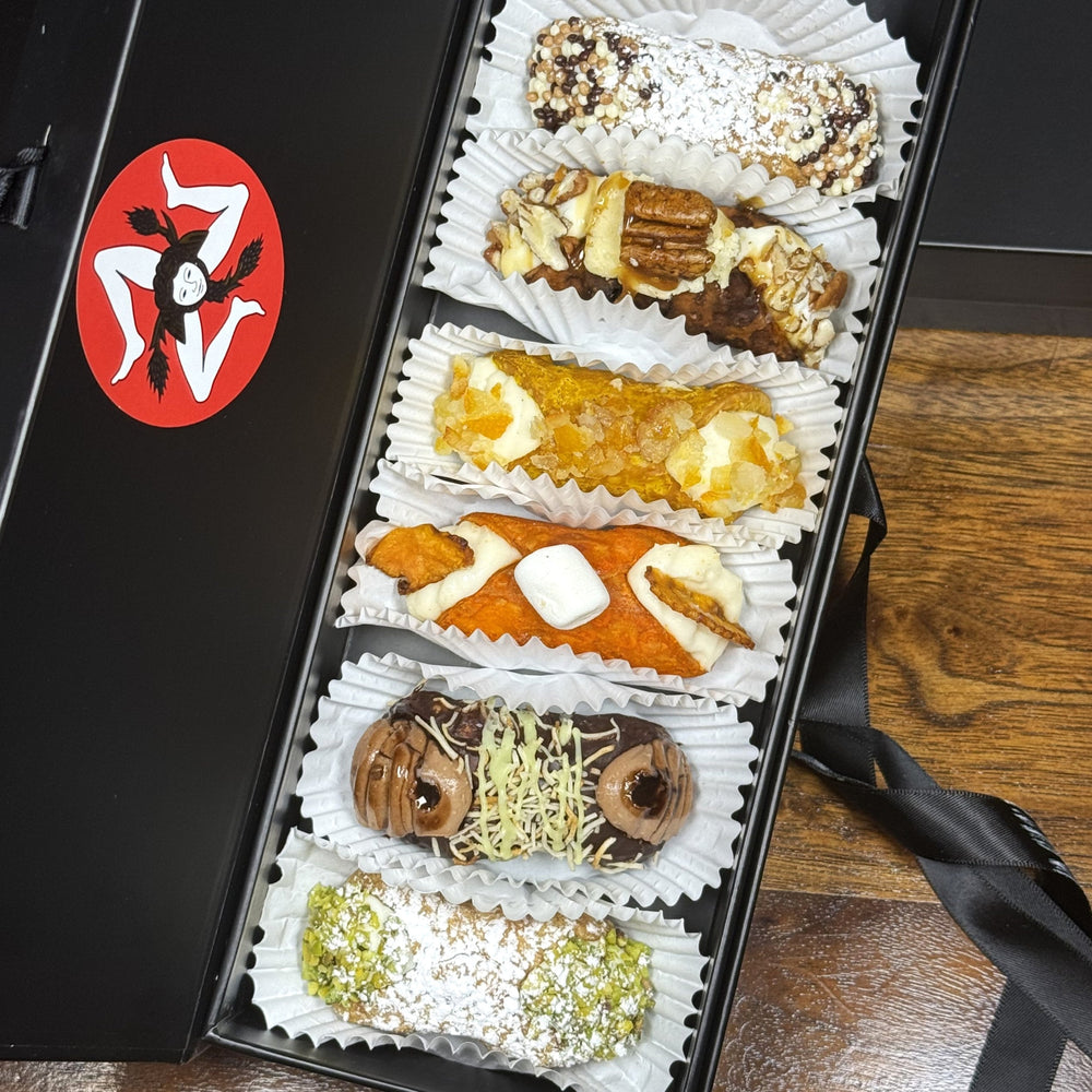  Included in the SetBox of 6 Small Gourmet Cannoli are:

Top to bottom:&nbsp; Traditional Chocolate, The Maple Pecan Fudge, The Yuzu, The Marshmallow Sweet Potato, The Dubai Chocolate Lava, and Traditional Pistachio.&nbsp;

So much to be grateful for this Season--share the love with cannoli!