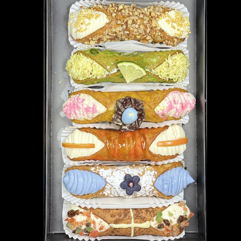 Included in the SetBox of 6 Large Gourmet Cannoli are:


Top to bottom:&nbsp; The Sohan, The Nanaimo, Cherries Jubilee, The Elderflower, Bailey's Irish Cream, and Blueberry Cheesecake.


Whether as a special treat for yourself or a delightful gift, this set offers an authentic taste of Italy that will satisfy even the most discerning sweet tooth. Treat yourself to the luxury of indulgence with our exquisite gourmet cannoli!