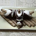 Experience pure decadence with our Chocolate-Covered Wafer Cannoli, a playful twist on a classic Italian treat. Each hand-rolled cannolo shell is lavishly coated in silky chocolate, creating a crisp, luxurious exterior. Inside, you'll discover a rich, velvety ricotta cream filling—smooth, subtly sweet, and irresistibly indulgent. At the heart of this confection is a hidden surprise: a crunchy chocolate wafer, adding a delightful layer of texture and bold cocoa flavour. 
