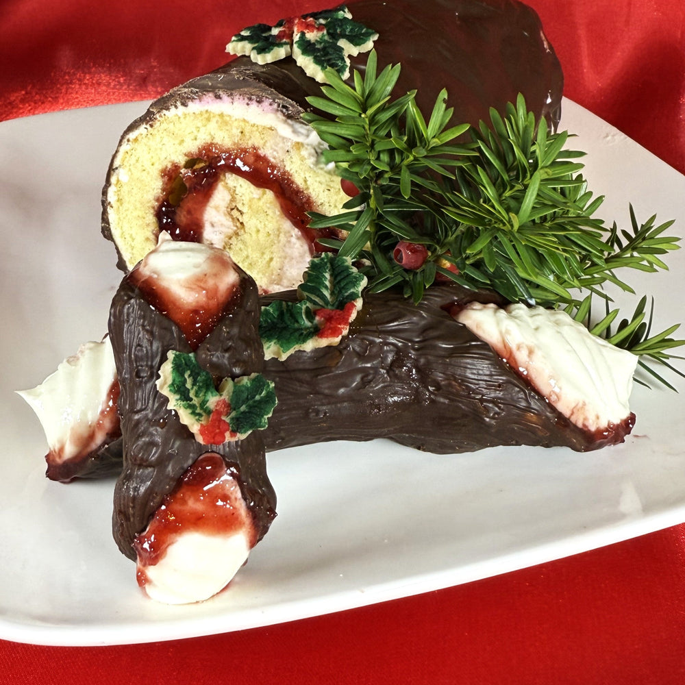 Celebrate the wonder of the Season with our Yule Log Cannoli, where classic Italian delight meets timeless holiday tradition. Each handcrafted chocolate-coated cannoli shell is baked to a delicate crisp, and filled with velvety ricotta cream infused with hints of vanilla and nutmeg. The swirl raspberry jelly filling mimics the cozy rings of a yule log, while a housemade marzipan decorates the top.