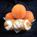 Every culture around the globe cherishes the juicy sweetness of an apricot.  At Cannoli Crunch, we have found a local, organic apricot jam to pipe into the centre of our creamy, smooth ricotta cheese.  Encased in our crispy, crunchy pastry shell and sprinkled with powdered sugar, our Signature Jelly Cannoli is a new apricot delicacy!