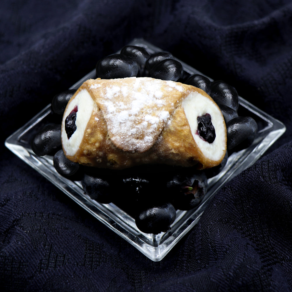 Cannoli Crunch has made enough jelly to last the whole year through from northern Ontario's laden blueberry bushes.  As one of our Signature Jelly Cannoli, we fill our smooth, creamy ricotta cheese with a centre of organic blueberry jam which is surrounded by our crispy, crunchy pastry shell.  It's just brimming with flavour! 