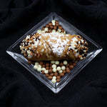 Tradition is something we stand by at Cannoli Crunch.  We are proud of our heritage and what it has brought into our lives.  Standing true to our philosophy and to the creation of the cannoli, we take pride in sharing with you the Traditional Chocolate Cannoli.  Smooth, creamy ricotta, deep-fried cannoli pastry shell, and chocolate pearls.  Perpetual perfection! 
