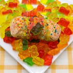 What a fun treat this is!  It's for all the kids at heart.  Our Gourmet Gummi Bear Cannolo is bursting with a rainbow of fruity flavors combined with our smooth and creamy ricotta. From luscious strawberry and zesty orange to tangy lemon and juicy grape, each bite offers a mouthwatering explosion of taste.  Decorating the cannolo is colourful crystal sugar, drizzles of fruity icing, and of course, a chewy Gummi Bear.  This crispy, crunchy cannolo will be bouncing in your mouth with loads of taste and fun!!