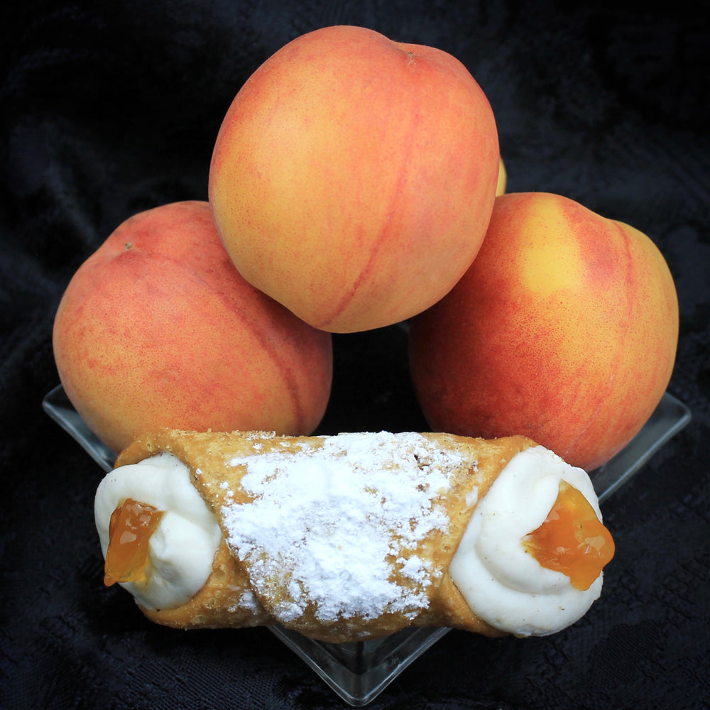 Cannoli Crunch's  Signature Jelly Collection boasts an organic peach jam centred cannoli.  This luxuriously decadent flavour is surrounded by our creamy, smooth ricotta and encased in our crispy, crunchy pastry shell.  It's a nod to the Siciliani tradition with our twist!