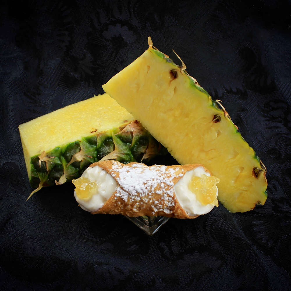 Our Signature Jelly Cannoli Collection is graced with the regal pineapple jelly this month.  Organic pineapple jam has been locally sourced and we pipe this sumptuous, sweet, and tangy preserve into the centre of our creamy, smooth ricotta.  Surrounded by our crispy, crunchy pastry shell and sprinkled with powdered sugar... this cannoli is perfectly splendid! 
Available with a dairy-free cream filling!