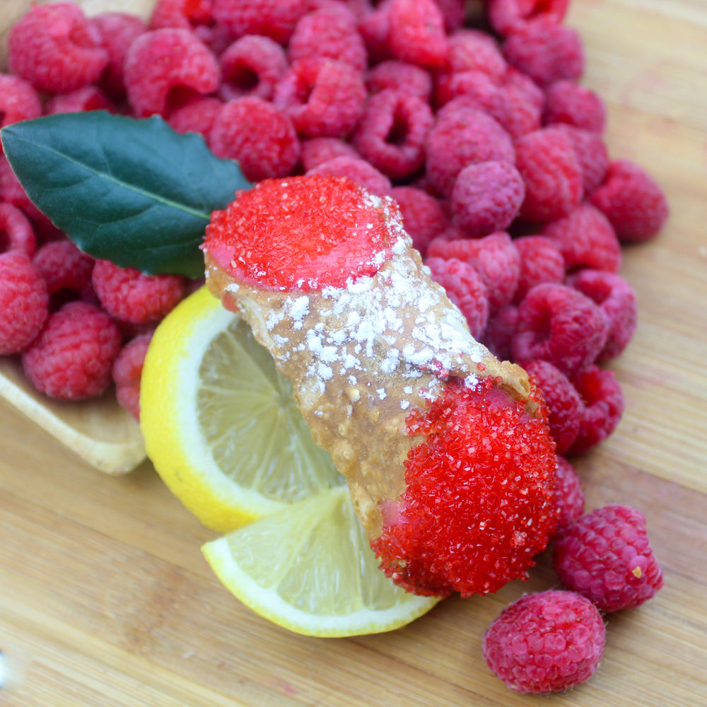 DAIRY FREE:  Imagine a field of fresh raspberries mingled with an orchard grove of lemons.  One day they decide to join forces and create a gelato.  Yes, that's correct... the sweetness of raspberry and tartness of lemon!  We have taken this wonderful flavour of gelato from Coppa Di Gelato Company and filled our homemade, crispy crunchy, deep-fried cannoli shells.   A light dusting of powdered sugar and ruby sugar crystals adds to the beauty and joy!    www.cannolicrunch.ca