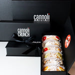 Born in tradition... Inspired by art!  Cannoli Crunch's SetBox of Traditional Cannoli pays tribute to over 1200 years of this delicate Siciliani pastry.  Our creamy, smooth ricotta is gently piped into our housemade cannoli shells, dusted with icing sugar, and trimmed with traditional embellishments.    Top to bottom:  Cherry, Plain, The Everything, Pistachio, Chocolate, and Orange.