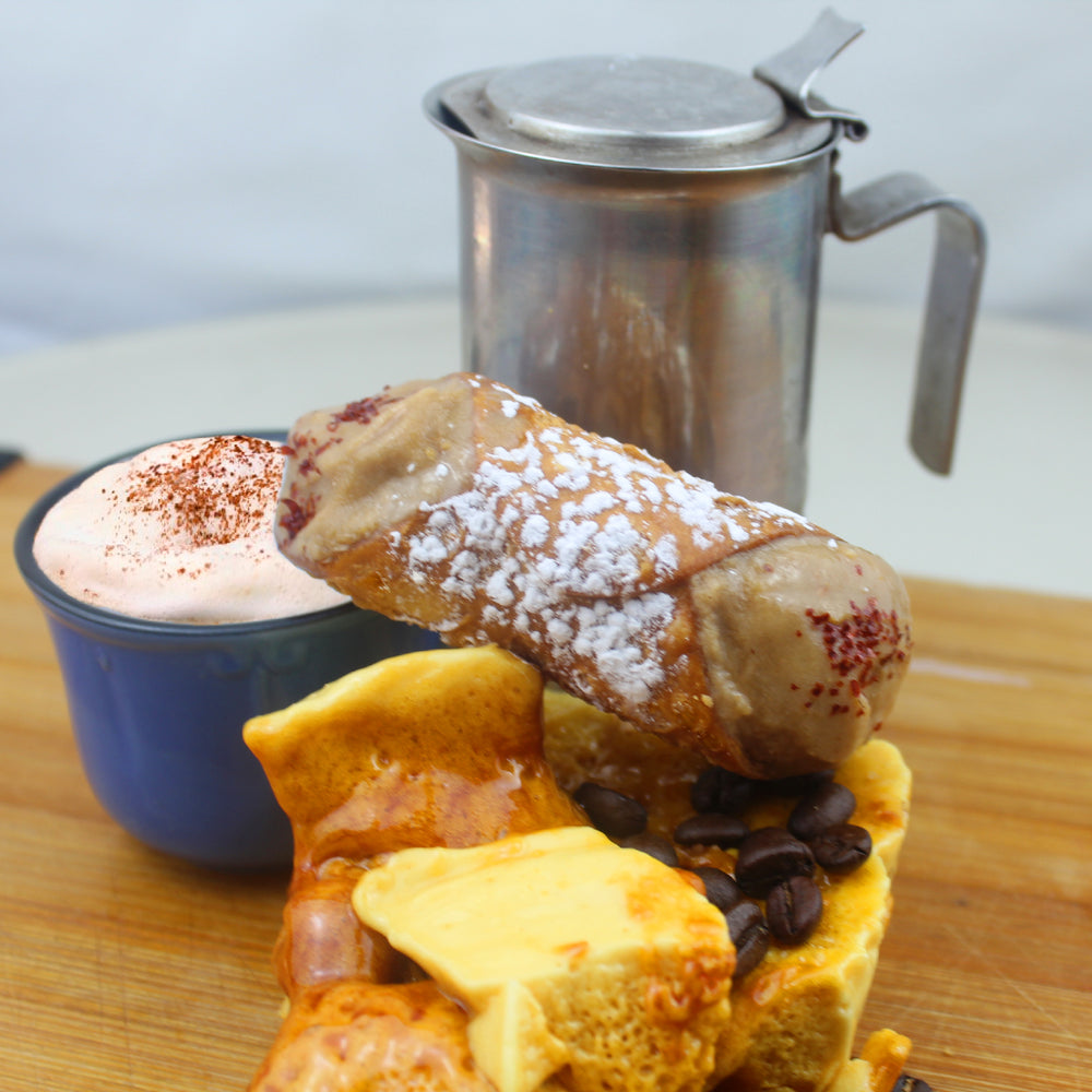 Here at Cannoli Crunch, we know a few things about Italians at heart.  We know they love their coffee.  We also know they love their gelato.  So why not combine the two?  With the help of Coppa Di Gelato, we have our crispy-crunchy deep-fried cannoli shell filled with a gelato flavour to bring joy to those two loves with an added twist of toffee.  A dusting of powdered sugar and crystal sprinkles finishes the decadence.  www.cannolicrunch.ca