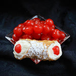 Born in Tradition... Inspired by Art!  That's our motto!  Cannoli Crunch presents an age-old and much beloved Traditional Cherry Cannoli filled with our creamy, smooth ricotta gently piped into our crispy, crunchy pastry shells, adorned with maraschino cherries and dusted with powdered sugar!  Grazie Sicilia! 