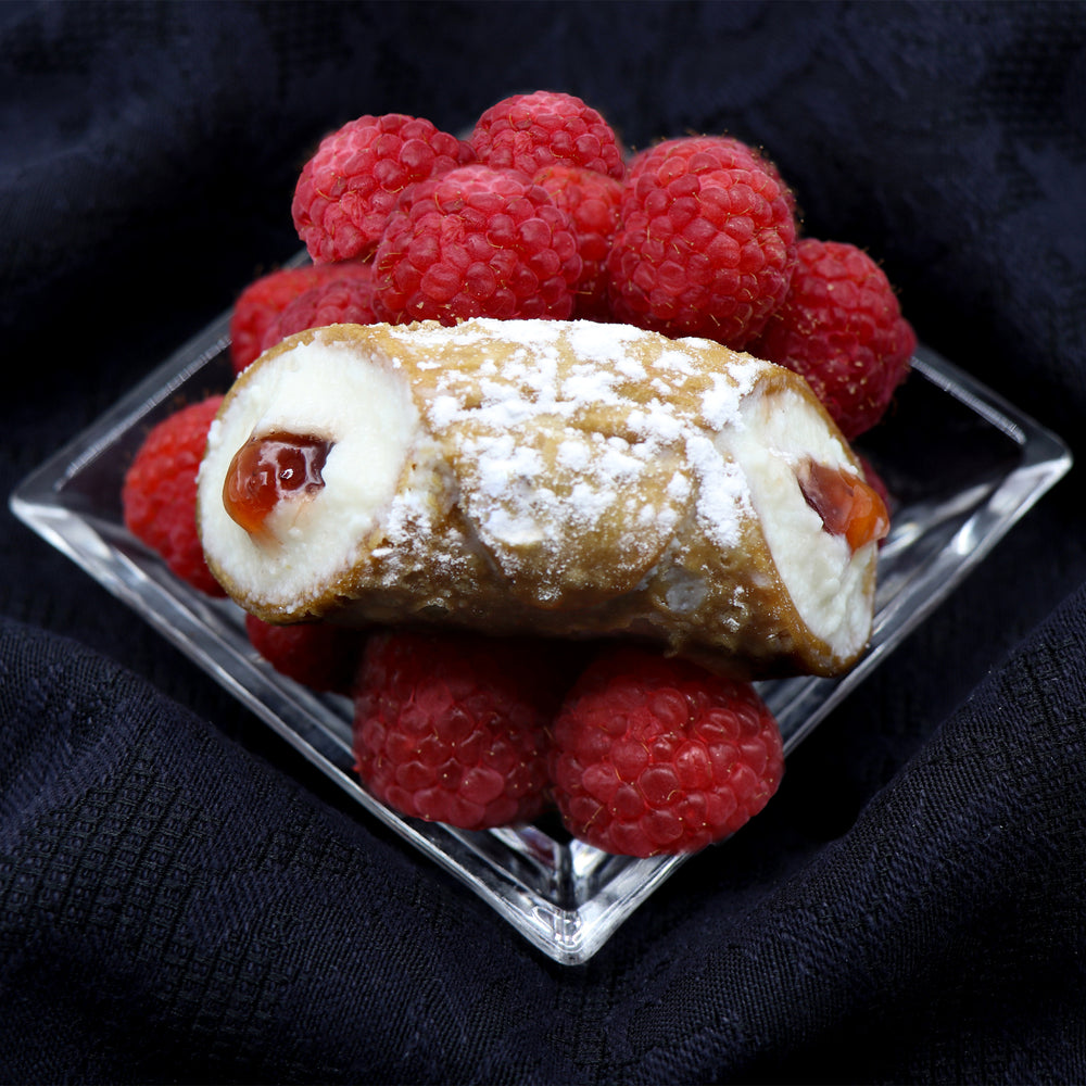Organic raspberry jelly fills the centre of our smooth, creamy ricotta inside of our crispy cannoli shell.  From the first bite to the last, you will savour every single morsel with a smile on your face as you taste the sweet and tart combination.   
Available with dairy-free cream filling! www.cannolicrunch.ca
